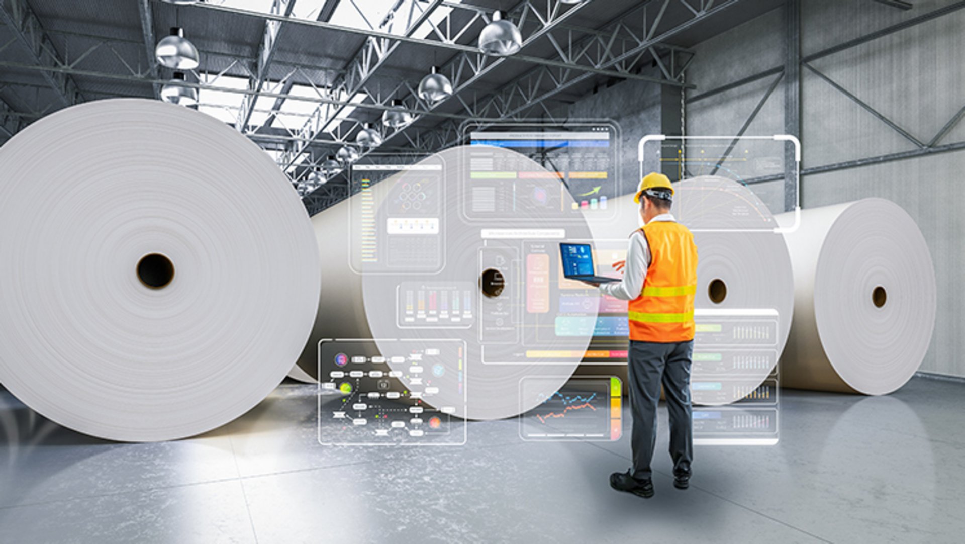 In einer Lagerhalle sind zwischen einem Laptop-haltenden Ingenieur einer Papierfabrik und fertig produzierten Papierrollen überdimensionale Einblendungen digitaler Charts zu sehen.